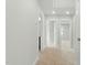Hallway with neutral walls and carpet leading to various rooms at 22 Whistling Way # 18, Lillington, NC 27546