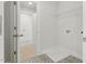 Laundry room with hookups, shelving, and patterned flooring at 22 Whistling Way # 18, Lillington, NC 27546