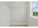 Walk-in closet with wire shelving and a window offering natural light at 22 Whistling Way # 18, Lillington, NC 27546