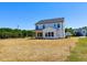 Spacious backyard showcasing a new construction home with ample space for outdoor activities and landscaping at 22 Whistling Way # Holly Farmhouse, Lillington, NC 27546