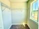 Walk-in closet featuring wire shelving and a window with views of the surrounding landscape at 22 Whistling Way # Holly Farmhouse, Lillington, NC 27546