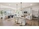 Spacious kitchen with island, pendant lighting, and modern appliances at 22 Whistling Way # Holly Farmhouse, Lillington, NC 27546