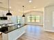 New kitchen features granite countertops, kitchen island, recessed lighting, backsplash and luxury vinyl floors at 22 Whistling Way # Holly Farmhouse, Lillington, NC 27546