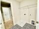 Laundry room with patterned tile flooring and storage at 22 Whistling Way # Holly Farmhouse, Lillington, NC 27546