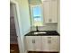 Mudroom with tiled backsplash, black hardware, and a window to view the neighborhood at 22 Whistling Way # Holly Farmhouse, Lillington, NC 27546