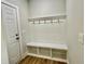 Mudroom with a bench, hooks, and cubbies for storage at 22 Whistling Way # Holly Farmhouse, Lillington, NC 27546