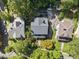 An aerial view showcases the well-maintained home, its landscaping, driveway, and neighboring houses at 230 E Park Dr, Raleigh, NC 27605
