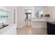 Light-filled dining area with built-in shelving, mini-fridge, and a view into adjacent rooms at 230 E Park Dr, Raleigh, NC 27605