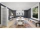 Dining room with a modern chandelier and a vibrant colorful rug at 230 E Park Dr, Raleigh, NC 27605