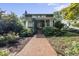 Charming home with a welcoming brick path and lush greenery at 230 E Park Dr, Raleigh, NC 27605