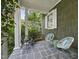Comfortable front porch seating with stylish chairs at 230 E Park Dr, Raleigh, NC 27605
