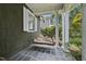 Cozy front porch with a porch swing and classic wood architecture at 230 E Park Dr, Raleigh, NC 27605