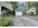 View of a detached two-car garage with a driveway at 230 E Park Dr, Raleigh, NC 27605