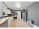 Modern kitchen with stainless steel appliances and natural wood countertops at 230 E Park Dr, Raleigh, NC 27605
