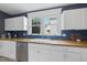 Bright kitchen with butcher block countertops and white cabinets at 230 E Park Dr, Raleigh, NC 27605