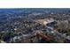 Scenic aerial shot of a neighborhood, showcasing the city skyline in the distance, with property lines highlighted at 306 S Driver St, Durham, NC 27703