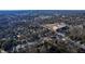 Scenic aerial shot of a neighborhood, showcasing the city skyline in the distance at 306 N Driver St, Durham, NC 27703