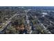 Wide aerial shot of a quiet neighborhood with tree coverage and winding streets, with property lines highlighted at 306 N Driver St, Durham, NC 27703