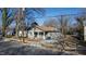 Charming craftsman-style home with a welcoming front porch and mature trees in a residential neighborhood at 306 N Driver St, Durham, NC 27703