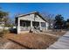 Inviting single-story home with a covered porch and a well-maintained yard at 306 N Driver St, Durham, NC 27703