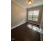Bright bedroom with light walls and a large window at 3144 La Costa Way, Raleigh, NC 27610