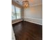 Bright dining area featuring modern lighting, stylish table, and large window overlooking the outdoors at 3144 La Costa Way, Raleigh, NC 27610