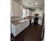 Well-equipped kitchen with white cabinets, sleek countertops, and modern black appliances at 3144 La Costa Way, Raleigh, NC 27610