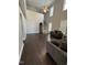 Spacious living room with soaring ceilings, staircase, and comfortable seating area at 3144 La Costa Way, Raleigh, NC 27610