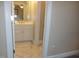 Bathroom with a marble tiled floor, white vanity, and white walls at 325 Sandy Ridge Rd, Dunn, NC 28334