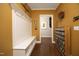 Hallway with coat rack and storage that leads to the stairs at 340 Rose Walk Ln, Carrboro, NC 27510