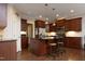 Well-lit kitchen with an island, stainless steel appliances, and plenty of counter space at 340 Rose Walk Ln, Carrboro, NC 27510