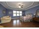 Spacious main bedroom with tray ceiling, hardwood floors, and a large window at 340 Rose Walk Ln, Carrboro, NC 27510