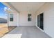 Relax on this covered back patio with ample space and light from the sliding glass door at 366 Tormore Dr, Sanford, NC 27330