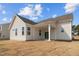 The home's backyard features an elegant covered patio and beautiful lawn at 366 Tormore Dr, Sanford, NC 27330