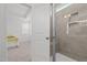 Bright bathroom with glass shower, tile, and neutral decor for a spa-like experience at 366 Tormore Dr, Sanford, NC 27330