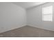 Bright, airy room featuring neutral carpet and a large window that fills the space with light at 366 Tormore Dr, Sanford, NC 27330