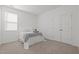Comfortable bedroom with a cozy bed, soft carpet, and a large closet for ample storage at 366 Tormore Dr, Sanford, NC 27330