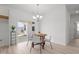Bright dining area with modern chandelier and sliding glass doors leading to the outdoor space at 366 Tormore Dr, Sanford, NC 27330