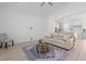 Bright living room with vaulted ceilings, modern decor, and seamless access to the kitchen at 366 Tormore Dr, Sanford, NC 27330