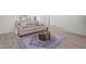 Cozy living room with stylish furniture, modern decor, and wood floors at 366 Tormore Dr, Sanford, NC 27330
