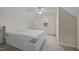 A bedroom with neutral walls, carpet, and ceiling fan, offering a relaxing and comfortable space at 3738 Lindsey Woods Rd, Hillsborough, NC 27278