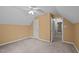 A bedroom with neutral walls, carpet, and open doorway, offering a relaxing and comfortable space at 3738 Lindsey Woods Rd, Hillsborough, NC 27278