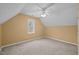 A bedroom with neutral walls, carpet, and window, offering a relaxing and comfortable space at 3738 Lindsey Woods Rd, Hillsborough, NC 27278