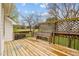 Inviting backyard deck with wooden trellis and views of the lawn at 3738 Lindsey Woods Rd, Hillsborough, NC 27278