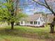 Charming single-Gathering home featuring a welcoming front porch and beautiful lawn at 3738 Lindsey Woods Rd, Hillsborough, NC 27278