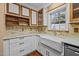 Updated kitchen featuring custom cabinets, stone countertops, and stainless steel appliances for modern convenience at 3738 Lindsey Woods Rd, Hillsborough, NC 27278
