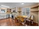 Bright eat-in kitchen showcases stainless steel appliances, a window view, and charming wood accents and dining area at 3738 Lindsey Woods Rd, Hillsborough, NC 27278