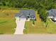 Aerial view showcasing the home's location and manicured landscaping in a serene neighborhood at 40 Cinnamon Teal Way, Youngsville, NC 27596