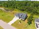 Aerial view of home showcasing well-maintained landscaping and proximity to a pond at 40 Cinnamon Teal Way, Youngsville, NC 27596