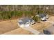 An elevated view of the house showing the roofline, expansive yard and proximity to the surrounding wooded areas at 40 Cinnamon Teal Way, Youngsville, NC 27596